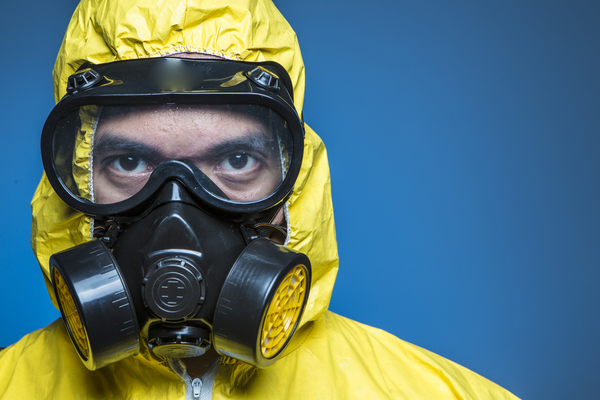 Man in hazmat suit ready for biohazard cleanup