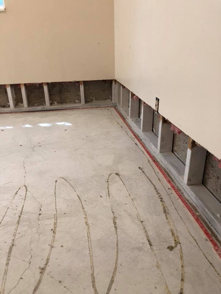 Floor tiles removed during mold removal procedure