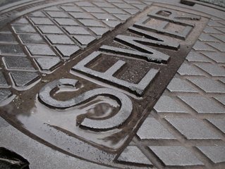 Sewer cap showcasing the need for sewer backup cleanup